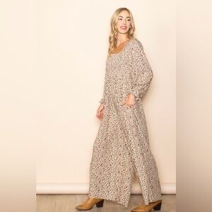 NWOT Floral Smocked Wide Leg Long Sleeve
Boho Jumpsuit w Pockets tag removed New